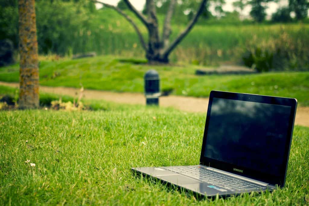 digital marketing laptop on grass as we focus on the regional aspect of computer support